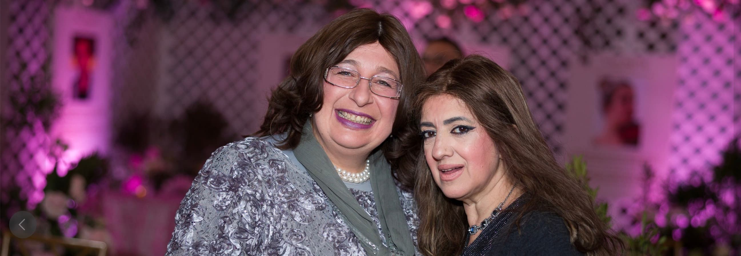 Two friends smiling at the event