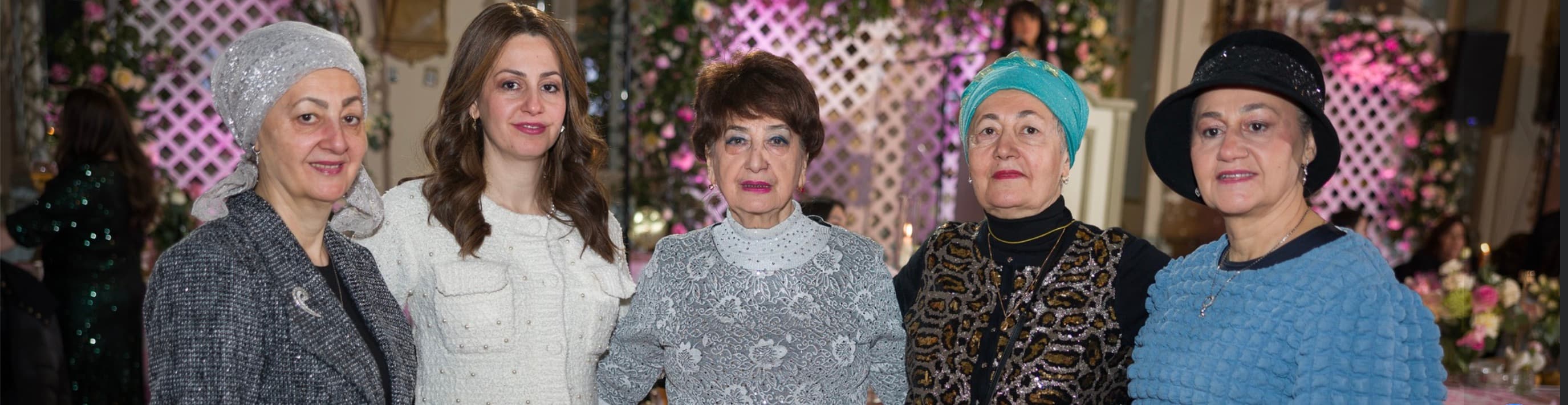 Five friends posing at the event